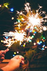 New_Years_Sparklers_with_Christmas_Lights_in_the_background